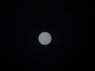 The image shows a full moon in a dark sky. The coordinates provided correspond to a location in Batam, Indonesia. The moon is white and round, and it is the only visible object in the image.