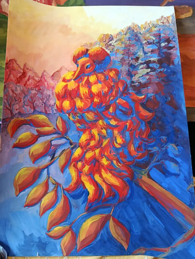 This is a colorful, expressive painting of a bird perched on a branch. The bird is the central subject, rendered in vibrant shades of red and yellow, with blue accents defining its features. Its plumage is depicted with energetic, swirling brushstrokes, giving it a textured, almost fiery appearance. The bird has a distinct eye, also in blue.
The bird is positioned on a branch that extends into the foreground, adorned with large, stylized leaves. These leaves are painted in warm tones of yellow and orange, with red highlights and blue shadows, echoing the colors of the bird. The branch itself is a reddish-brown, contrasting with the bright blue background.
The background is a landscape scene, with a suggestion of mountains or hills in the distance on the left, rendered in reds and purples. To the right, the background depicts a forest or trees with a mix of blue, purple, and some lighter colors, suggesting a cool, perhaps autumnal or wintery, atmosphere. The sky above the distant landscape is a soft gradient of yellow and orange, indicating a warm light source, possibly sunrise or sunset.
The overall impression is one of bold color choices and dynamic brushwork. The use of contrasting colors, particularly the bright oranges and reds against the deep blues, creates a sense of energy and vibrancy. The painting appears to be an acrylic or gouache on paper or canvas, given the texture and opacity of the paint. There is no visible text in the image. The style suggests a focus on emotional expression and visual impact rather than photorealism.