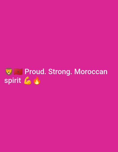 The image is a digital graphic with a bright pink background. In the center of the image, white text reads "Proud. Strong. Moroccan". To the left of the text are four emojis: a lion's head, the flag of Morocco, a flexed bicep, and a flame. Below the line of text, the word "spirit" appears in white, followed by the flexed bicep and flame emojis again. There is no discernible location in the city of Safi, Morocco, or any people present in the image.