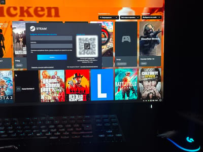 The image shows a computer screen displaying the Steam gaming platform. A login pop-up window is prominent, asking for a username and password. Below the login fields, it states, "According to Steam settings, account data is not stored on this PC." A blue "Login" button is visible within the pop-up. To the right of the login fields, there's a QR code for logging in via a mobile device, with the text "Use the Steam mobile app to log in with a QR code."
The background of the Steam interface shows various game tiles, including "DOTA 2," "PUBG BATTLEGROUNDS," "Forza Horizon 5," "Grand Theft Auto V," "Red Dead Redemption II," a tile with a large blue "L," "Iccup," "Counter-Strike 1.6," and "Call of Duty: WWII." Some of these tiles have associated text labels such as "Pubg," "Games," and "Приложения" (Applications).
Above the game tiles, there are sorting and category options, with text labels like "Sort by:" and "Categories:". There are also "Parameters:" with a dropdown.
The scene is indoors, with a keyboard and a gaming mouse visible in the foreground. The mouse has RGB lighting. The overall lighting suggests it is likely evening or night, as the screen is the primary light source. The time "16:21" is visible on a taskbar-like element at the bottom of the screen. The presence of the Steam platform indicates a setting related to gaming. There are no visible cues about weather or emotions. The text is predominantly in Russian.