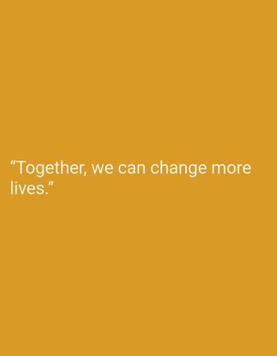 The image displays a uniform, solid orange-yellow background. Centered in the lower-left quadrant of the frame is white text, rendered in a sans-serif font. The text reads: "Together, we can change more lives." No other subjects, objects, people, or environmental details are discernible. There are no visual cues indicating a specific location in Andijan, Uzbekistan, or any other geographical area.