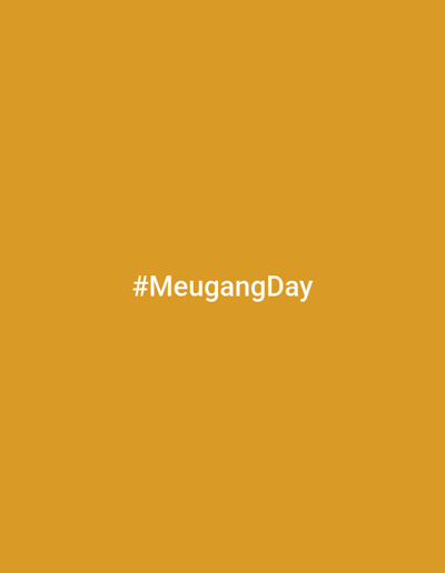 The image is a solid mustard yellow background with the text "#MeugangDay" in white in the center. There are no other elements in the image. The image does not provide sufficient information to determine a location in Kutaglumpang, Indonesia or any details about people, subjects, objects, actions, interactions, or the environment.