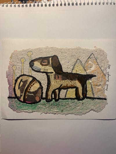 This media file features a collage artwork on textured, off-white paper. The artwork depicts a stylized dog-like figure in shades of brown and black, with collage elements of text and patterns. The dog's head is on the left, with a prominent eye. Its body is elongated, with legs tucked beneath. Below the dog is a circular object, also made of collage, which appears to be a ball or toy. Three yellow, stick-like shapes extend from beneath the dog and ball. The background is a mix of abstract colors, including green, yellow, and pink, with some scribbled lines.
Visible text in black ink at the top right reads: "Pawel Kurash 2017".
The artwork is presented on a white background, with a spiral-bound notebook visible on the left edge of the image. The lighting suggests it is indoors, likely in daylight. The overall mood of the artwork is whimsical and abstract. No specific scene, setting, or event is depicted beyond the stylized elements of the collage itself. The location context provided is Sergeevo, Russia, but there are no visual cues within the image to confirm this.