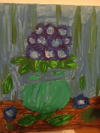 The image is a painting of a vase of flowers. The vase is green and is filled with blue flowers. There are also some green leaves around the vase. The background is a blue and green striped curtain. The painting is done in an impressionistic style with visible brushstrokes. There is no indication of the location in the city of Kielce, Poland.