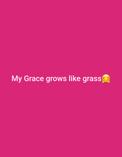 The image contains white text on a pink background. The text reads "My Grace grows like grass" followed by a smiling emoji with rosy cheeks. The background is a solid, vibrant pink color. There are no people, objects, or environmental features visible other than the text and emoji. There is no information in the image to suggest a location in Gwagwada, Nigeria.