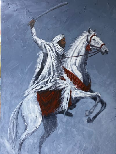 This is an acrylic or oil painting on canvas, observed in Ikate, Nigeria. The artwork depicts a dark-skinned male rider on a white horse, positioned in a dynamic, right-facing profile against a textured, cool grey background. The rider is clad in flowing white robes, including a hood or turban that partially obscures his face, and has his right arm raised high, brandishing a silver-colored sword with a dark grip. His face, visible in profile, shows a serious expression. The white horse is depicted rearing or galloping with its front legs lifted, adorned with a red bridle, reins, and possibly a red saddlecloth or decorative element visible beneath the rider's garments. The painting exhibits prominent brushstrokes and impasto texture, particularly in the white and red elements of the figures and the indistinct background.