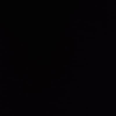 The image is entirely black. There is no discernible content, shapes, or textures visible. The uniformity of the blackness suggests a complete absence of light or information in the depicted scene.