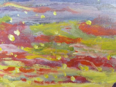 The image is a close-up, abstract painting of a landscape with textured brushstrokes. The colors are predominantly warm, with vibrant reds, oranges, and yellows blending with cooler blues and purples. Small, circular dabs of yellow paint are scattered throughout, resembling highlights or blossoms. The painting is done on canvas, as evidenced by the visible weave. There is no information or context provided within the image itself that would allow for its location in Rybnitsa, Moldova, to be determined.
