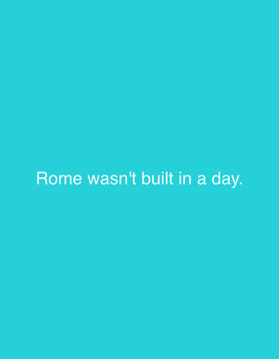 The image is a minimalist graphic with a solid turquoise background. Centered on the background, in white text, are the words "Rome wasn't built in a day." There are no people, objects, or any discernable details related to the city of Yemelyanovo, Russia.