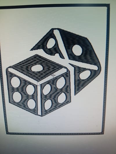 The image displays a graphic illustration of two dice. One die is in the foreground, appearing as a standard cube with pips on its visible faces, showing a "six" on the side and a "four" on the top. Behind it, a second die is partially visible, angled and appearing to show a "five" on its top face. Both dice are rendered in a dark, textured style, with lighter pips and highlights. The illustration is enclosed within a rectangular border. The scene is digitally rendered and does not depict a real-world location. There is no indication of Rumuepirikom, Nigeria, or any specific urban environment.