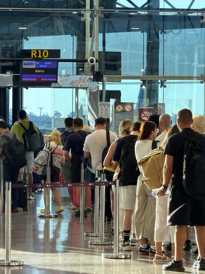 The media file shows a queue of people at what appears to be an airport departure gate, possibly at Barcelona–El Prat Airport in Spain, given the location context. The scene is indoors, with a large glass facade reflecting the sky, suggesting daytime. The lighting is bright, indicating it is likely daytime, possibly morning or afternoon. The people are diverse in age and attire, with some wearing casual clothing and others carrying luggage.
The primary activity is people waiting in line, likely for a flight. The presence of a departure board and queuing stanchions confirms the airport setting. The departure board displays flight information, including "RYANAIR," "FR 6300," "08:20," "SOFIA," and "NON-PRIORI." The yellow sign with "R10" might indicate the gate number or a section of the queue.
There are no overt displays of emotion, as people are focused on waiting. Some individuals are looking forward, while others are engaged in conversation or looking at their phones. The overall atmosphere seems orderly, typical of an airport environment. The reflections in the glass and on the polished floor add to the visual complexity of the scene. The cropped images provide closer views of individuals, their clothing, and specific details like luggage and footwear, as well as the departure board.