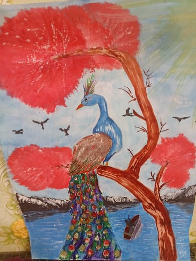 A vibrant watercolor painting depicts a blue peacock perched on a reddish-brown tree branch, its long, colorful tail feathers fanned out below. The peacock is the central subject, with its head turned to the left, showcasing its blue plumage and a crown of multicolored feathers. In the background, red, bushy foliage adorns the upper branches of the tree and appears in clusters on either side of the scene. The sky is a pale blue with hints of green and white clouds. Several small black birds are flying in the sky. Below the tree, a body of water, painted in shades of blue, stretches across the lower portion of the image. In the water, a small brown boat with a single dark figure inside is visible. In the distance, snow-capped mountains form a dark line separating the water from the sky. The painting has a folk-art style, with bold colors and simplified forms. The overall scene evokes a natural, serene landscape. The location of Seýdi, Turkmenistan is not depicted or suggested in this artwork.