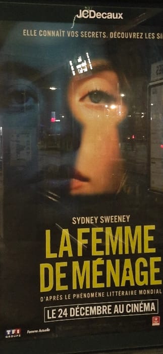 The image is a poster for the movie "La Femme De Menage," starring Sydney Sweeney. The film is based on a literary phenomenon and will be released in cinemas on December 24th. The poster prominently features an eye and part of Sweeney's face. "JCDecaux" is displayed at the top-left corner, along with the text "Elle connaît vos secrets, découvrez les si..." The TFI Groupe and "Femme Actuelle" logos appear at the bottom-right corner.