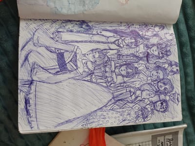 The image is a close-up, overhead shot of an open sketchbook lying on a dark green textured surface, likely a blanket or upholstery. The sketchbook page is filled with a detailed pen-and-ink drawing rendered in dark blue ink. The drawing depicts a crowded composition of figures, primarily faces and upper bodies, with a focus on intricate clothing and hairstyles. The style is sketchy and gestural, with rapid lines used to define forms and create shading.
The figures appear to be a mix of male and female, with varied expressions and poses. Some are looking directly at the viewer, while others are depicted in profile or with their faces turned away. There is a sense of a narrative or a gathering, with the figures overlapping and intertwining. The clothing suggests a historical or fantasy setting, with elaborate collars, headwear, and patterned fabrics. One prominent figure in the foreground on the left is depicted with a large, flowing garment.
The sketchbook itself appears to be well-used, with some slight creasing and a few faint smudges of color, possibly watercolor, near the top edge of the page. The lighting is diffused, highlighting the texture of the drawing and the surrounding surface.
The question about the "location in the city of Посад, Russia" is not supported by any visual evidence in the image. The image is a close-up of a drawing in a sketchbook and does not contain any recognizable landmarks, signs, or contextual elements that would place it in any specific geographical location, including Посад, Russia.