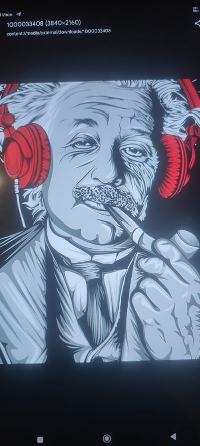 The image is a close-up, stylized illustration of Albert Einstein wearing red headphones and smoking a pipe. The artwork is rendered in shades of gray, black, and white, with red accents for the headphones. The details of Einstein's face, including his characteristic messy hair, mustache, and wrinkled skin, are prominent. His eyes are looking directly at the viewer. His hands are visible, one holding the pipe and the other obscured by his clothing. The background is dark. The image appears to be a digital illustration, possibly used as wallpaper or a graphic design element.
There is no information in the image to suggest any specific location in the city of Svitlovodsk, Ukraine. The text overlay in the top left corner contains file information and a date in Russian ("9 Июн", meaning "June 9"), but this does not provide any geographical context.