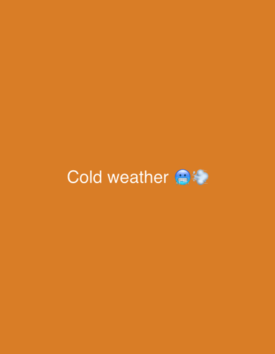 The image is a digital graphic with an orange background. In the center of the image, the words "Cold weather" are displayed in white text. To the right of the text is a blue emoji of a face with its mouth open and frost on its cheeks, accompanied by white wisps of smoke or mist. The image is centrally framed against a solid orange backdrop. There are no people, objects, actions, or interactions depicted that would relate to a specific location in Edopa, Nigeria.
