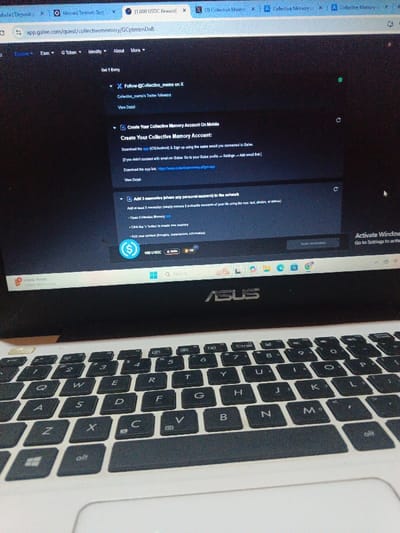 The image shows a laptop computer with a white lid and black keys. The screen displays a web page with the address "app.galxe.com/quest/collectivememory/GCptmmDa8". The page contains text and buttons related to a "Collective Memory" app, including instructions to "Create Your Collective Memory Account on Mobile" and "Add 3 memories (share any personal moment) to the network". The laptop is sitting on a surface and the image is taken from a slightly elevated angle. The location is Purwakarta, Indonesia, with coordinates -6.641 latitude and 107.378 longitude.