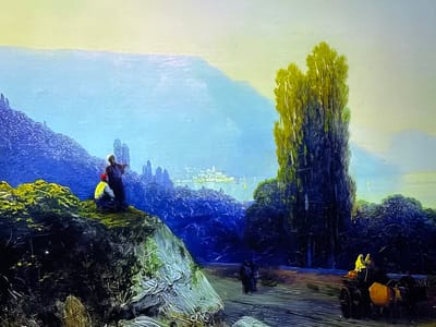 The image is a painting depicting a serene coastal landscape that represents a location in the city of Reus, Spain. The upper third of the canvas features a pale yellow-green sky, subtly transitioning to a light blue hue at the horizon. Below this, a wide expanse of light blue water, likely a sea or large bay, stretches across the midground. In the far distance, across the water, a cluster of white or light-colored buildings forms a distant city silhouette, with faint glints of light on the water nearby.

In the left foreground, a rugged, dark hill or cliff is covered with textured dark green and lighter, dried-looking vegetation. Perched atop this hill are two figures. One stands upright, clad in dark attire, while the other sits or crouches, distinguished by a bright yellow top and a red cap, both seemingly observing the expansive view.

The midground and right foreground feature dense, dark blue-green foliage and trees. A tall, slender tree with bright green, vertically textured leaves stands prominently on the right side, extending high into the frame. A winding, light brown dirt path traverses the lower central portion of the image. Along this path, two dark-clad figures walk together in the midground. Further to the right and closer to the viewer, a two-wheeled, dark horse-drawn cart is visible, carrying two passengers, one of whom is wearing a bright yellow garment. A distinct yellow-orange object is affixed to or part of the cart. The overall lighting suggests either early morning or late afternoon, casting a soft glow over the tranquil landscape.