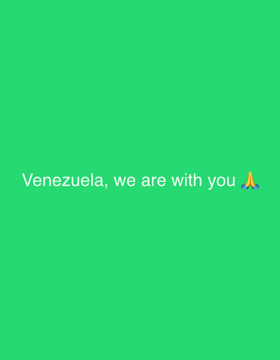 The image is a solid bright green background with the white text "Venezuela, we are with you" in the center. To the right of the text is an emoji of praying hands. There is no indication of the city of Pakhtakor, Uzbekistan within the image.
