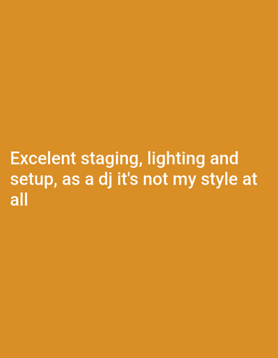 The image is a solid, warm yellow-orange background with text overlaid in white. The text reads, "Excelent staging, lighting and setup, as a dj it's not my style at all." The content is primarily textual and does not provide any details related to the city of Vicente López, Argentina.
