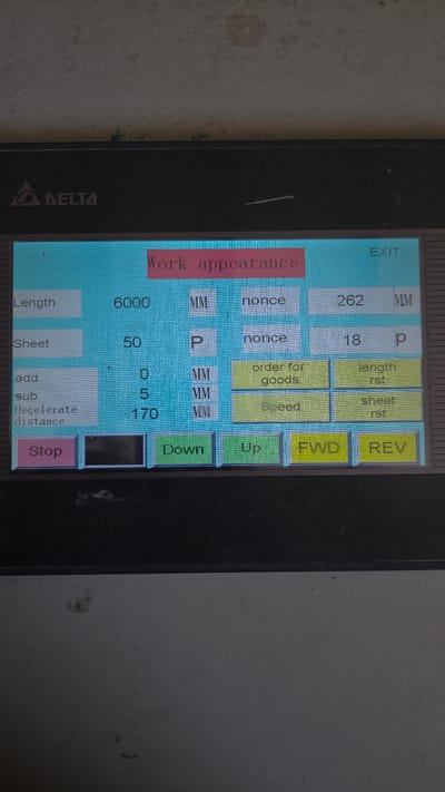 The image shows a screen displaying the "Work appearance" settings on a Delta branded device. The screen includes parameters such as "Length" set to 6000 MM, "Sheet" set to 50 P, "add" set to 0 MM, "sub" set to 5 MM, and "Decelerate distance" set to 170 MM. The screen also includes buttons labeled "Stop," "Down," "Up," "FWD," "REV," "length rst," "sheet rst," and "order for goods." The value 262 MM and 18 p are displayed on the upper right of the screen. The top of the screen also reads "EXIT". The location is not inferable from the image.