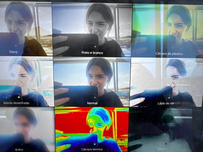 The image shows a grid of nine selfies of a woman taken with different camera filters on a mobile phone. The filters are labelled in Portuguese: "Raios X," "Câmara térmica," "Brilho," "Lápis de cor," "Normal," "Banda desenhada," "Câmara de plástico," "Preto e branco," and "Sépia." The background visible in the "Normal," "Preto e branco," and "Sépia" photos reveals a building and a coastal landscape. Based on the style of the building and the location of the woman during the shot of the window reflection, it is most likely that she is taking this picture from somewhere within the city of Torres Vedras, Portugal.