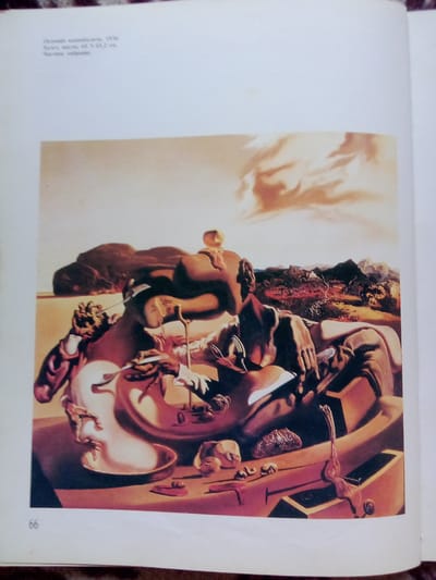 This media file contains an image of Salvador Dalí's surrealist painting "The Persistence of Memory." The scene depicts a desolate landscape under a hazy, warm-toned sky, possibly indicating dawn or dusk. In the foreground, soft, melting pocket watches are draped over various objects and surfaces. One watch melts over a strange, amorphous figure that lies on its side, its face contorted. Another watch melts over a tree branch. A third watch is intact and rests on a dark, box-like structure.
Several human-like figures are present. A distorted, melting face emerges from a dish-like object in the lower left of the painting, seeming to bleed liquid. In the center, a figure with a prominent nose and wearing a white shirt with rolled-up sleeves is shown with a fork in its hand, possibly interacting with the melting objects. Another figure, partially obscured, is seen in the background to the right, with a rabbit-like head. The background features rugged mountains and a body of water, rendered in a muted, earthy palette.
The overall mood is dreamlike and unsettling, characteristic of Dalí's work, suggesting themes of time, memory, and the subconscious.
Visible text includes "Осомаяии хххххххх, 1936." and "холст, масло, 63 х 93.2 см. Частное собрание." Additionally, the number "66" is visible in the lower left corner of the image. These captions suggest the painting's title, artist (though partially obscured), date, medium, dimensions, and ownership. The location context provided is Zhmerynka, Ukraine, though the painting itself does not contain any specific geographical markers that would definitively place it there.