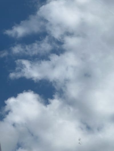 The image depicts a cloudy sky with patches of blue visible. The clouds are white and puffy, varying in density and texture. There are no visible people, structures, or specific landmarks identifiable in the scene. The overall impression is that of an outdoor, daytime shot of the sky. Due to the lack of any identifiable geographical features, it is not possible to determine if this image was taken in Neumünster, Germany, or any other specific location.