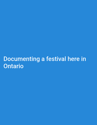 The image displays white text on a blue background. The text reads "Documenting a festival here in Ontario". There is no indication of the city of Pickering, Canada, or any specific location within it. The image is a graphic with text and lacks any visual elements that would depict a city, people, subjects, objects, or actions.