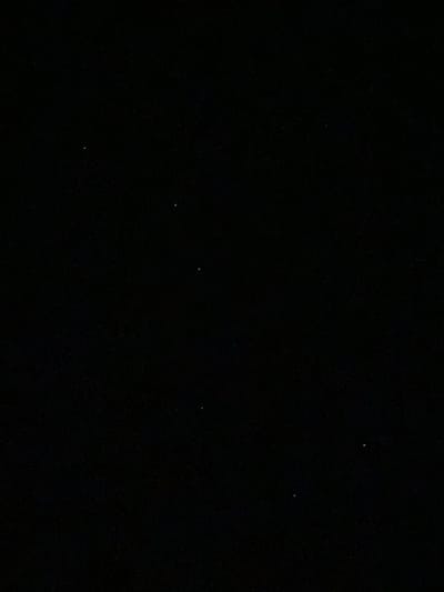 A very dark, near-black image shows several tiny, white dots that appear to be stars in the night sky. The image is an outdoor scene, with no discernible man-made structures, artificial lights, or terrestrial objects visible. The location is identified as Cairaclia, Moldova. The image is devoid of any people, animals, or specific actions. The environment is characterized by darkness and the presence of celestial bodies.