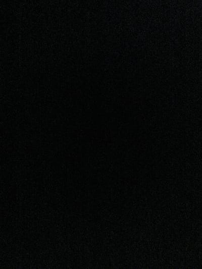 The image provided is a completely black frame with a grainy texture, suggesting a low-quality photograph or a deliberate artistic choice. There are no discernible objects, people, or environmental features visible. Therefore, it is impossible to provide any details about a scene in the city of Ермолкино, Russia, or any forensic description.