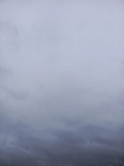 The image shows an overcast sky with dark, heavy clouds. The sky is predominantly a muted gray and blue, with variations in tone indicating the thickness and density of the cloud cover. There are no visible landmarks or human elements to indicate a specific location within the city of Meget, Russia. The image appears to be a general view of the sky.