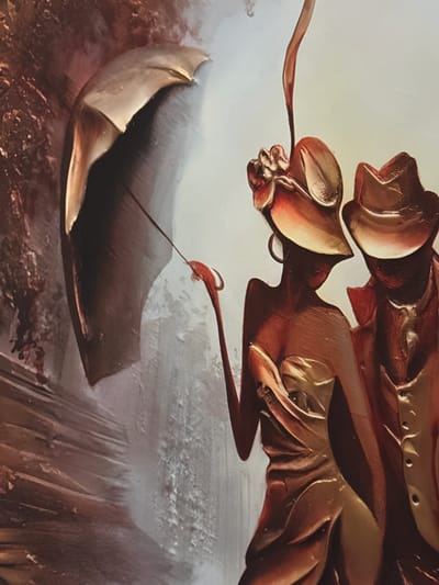 This is a close-up painting of two figures, a woman and a man, in stylized attire, possibly bronze or metallic in appearance, with a large umbrella. The woman is on the left, wearing a wide-brimmed hat adorned with a flower and a strapless dress. She is holding the umbrella with her right hand, which is extended. The man is on the right, wearing a hat and a jacket with buttons. They are depicted in a painterly style with visible brushstrokes and a metallic sheen. The background transitions from a dark, textured area on the left, possibly representing a wall or foliage, to a lighter, diffused area on the right. The lighting suggests a dramatic or moody atmosphere. There is no discernible connection to the city of Oldham, United Kingdom.