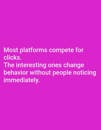 The image features a purple background with white text. The text reads: "Most platforms compete for clicks. The interesting ones change behavior without people noticing immediately." There are no people, subjects, objects, actions, interactions or environment depicted in the image other than the text and background.