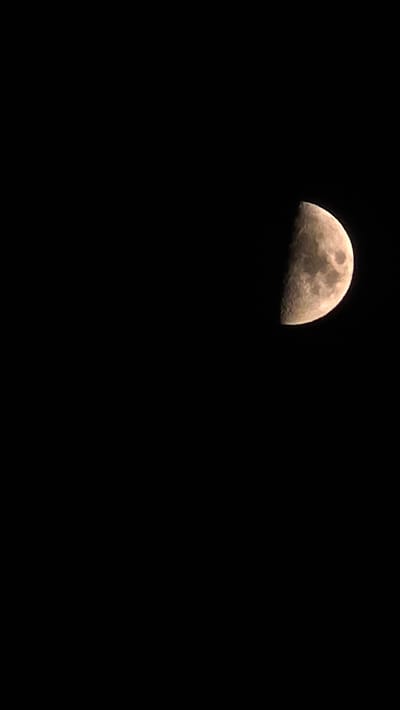A waxing gibbous moon is visible in a black night sky. The moon is partially illuminated, with the right side being brighter and showing more surface detail such as craters. The moon is positioned in the upper right quadrant of the image. The sky is completely dark and devoid of any other celestial bodies or light sources. There are no people, objects, or environmental elements present other than the moon and the sky. There is no indication of the city of Butor, Moldova in this image.