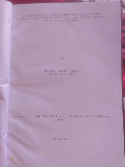 The image is a scan of a document's title page. The text is printed in a light gray font on a white background. The title reads: "THE IMPACT OF ORCHESTRA IN THE PERFORMANCE OF DANJA ABDULAHI'S DEATH AND THE KING'S GREY HAIR AND FEMI OSOFİSAN'S ONCE UPON FOUR ROBBERS". Below the title, centered, is the word "BY". Further down, also centered, is the name "HILLARY EZINDU HILLARY" followed by "TSU/FART/TF/21/1046". Below that, the text reads: "DEPARTMENT OF THEATRE AND FILM STUDIES, TARABA STATE UNIVERSITY, JALINGO". Finally, at the bottom of the page, it says "NOVEMBER, 2025". The document appears to be a thesis or academic paper. The location in the city of Magajin Gari, Nigeria is not mentioned in the image.