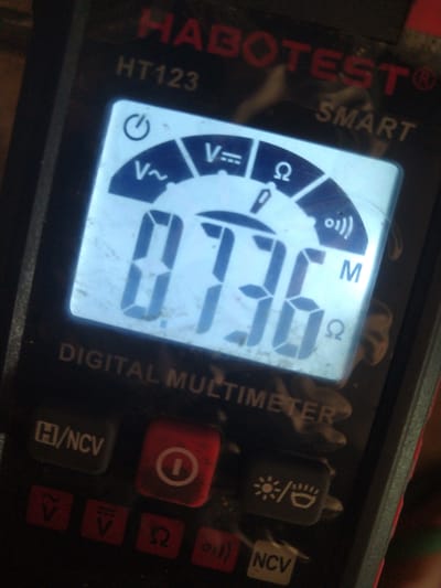 A digital multimeter is displayed, showing a reading of "0.736". The device is branded "HABOTEST HT123 SMART DIGITAL MULTIMETER". It is not possible to determine the location in Gampongbaro, Indonesia from the image.