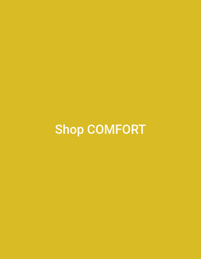 The image is a screen capture from a video with a solid mustard yellow background. Centered in the frame, in large white sans-serif text, are the words "Shop COMFORT". The text is crisp and clear, indicating it is likely a digital overlay or graphic element. There are no discernible subjects, objects, or scenery; the focus is solely on the text against the plain colored background. The context provided specifies the location as Suzak, Kyrgyzstan. No information about the time of day, weather, or emotional cues is available from the image itself. The only visible text is "Shop COMFORT".