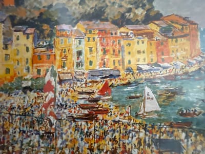 This oil painting depicts a bustling harbor scene in Punta Ala, Italy. The foreground is filled with a vibrant crowd of people, rendered in impressionistic strokes of color, suggesting a festive atmosphere. Many of the figures are small and indistinct, creating a sense of lively activity and a multitude of individuals.
In the middle ground, a body of water, likely the harbor, is dotted with various boats. Several small, dark vessels are moored or sailing, some with passengers. A prominent white sailboat with a single sail is a focal point, its sail marked with an emblem. To the left, a large red sail is visible, adding a splash of bold color to the scene. The water itself is depicted with blues and greens, reflecting the sky and the surrounding elements.
Behind the harbor, a row of colorful buildings lines the waterfront. These buildings are painted in warm hues of yellow, orange, and red, with varying shades of brown for the roofs. Their facades are textured, with small, dark shapes suggesting windows. The architecture hints at a Mediterranean coastal town. In the background, a dark, shadowed hillside or cliff rises behind the buildings, adding depth to the composition.
The overall impression is one of a sunny, lively day in a picturesque Italian coastal town, possibly during a festival or market day, given the large gathering of people and the presence of numerous boats. The style of the painting is loose and expressive, with visible brushstrokes contributing to the energetic feel of the scene. There is no visible text in the image.