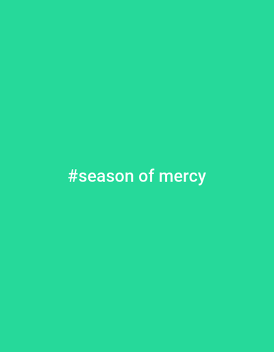 A vibrant, light green background fills the image. Centered horizontally and vertically is the phrase "#season of mercy" in white, sans-serif font. The hashtag symbol is clearly visible at the start of the phrase. The text is easily readable against the contrasting green background, creating a simple yet impactful visual message.