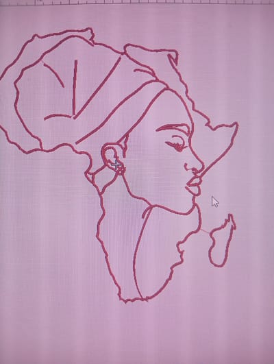 The image displays a close-up, over-the-shoulder view of a computer screen showing a digital drawing. The drawing is an outline illustration in red, depicting the continent of Africa combined with the profile of a woman's face. The woman is shown in profile, facing right, with a headscarf. The outline seamlessly integrates the geographical shape of Africa with the facial features, with the northern part of Africa forming the headscarf and the rest of the continent shaping the woman's face and neck. The background of the screen is a pale pink with a visible pixel grid pattern. There are no indications of people, subjects, objects, actions, interactions, or environmental details specifically relating to the city of Rumuepirikom, Nigeria, within the image itself.