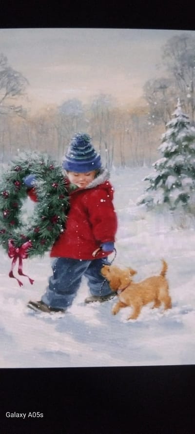 The image is a painting depicting a serene winter scene, likely set in Zavoy, Bulgaria. A young child, dressed in a blue and white striped winter hat with a pompom, a red winter coat, and blue pants, is shown lying or sitting in the snow. The child is holding or resting next to a large, vibrant green Christmas wreath adorned with red berries and a red bow.

Beside the child, a golden-brown dog, possibly a puppy, is captured in mid-stride, playing in the snow. The dog appears to be on a leash, which is connected to the child. The background features snow-covered evergreen trees, suggesting a forest or woodland area blanketed in white. Small white dots across the scene indicate light snowfall. The time of day appears to be daytime, with soft, ambient lighting. The overall mood conveyed is peaceful and heartwarming, depicting a moment of quiet enjoyment or rest during a snowy outing.

The text "Galaxy A05s" is visible on the bottom right edge, indicating the camera used to capture the image of the painting.