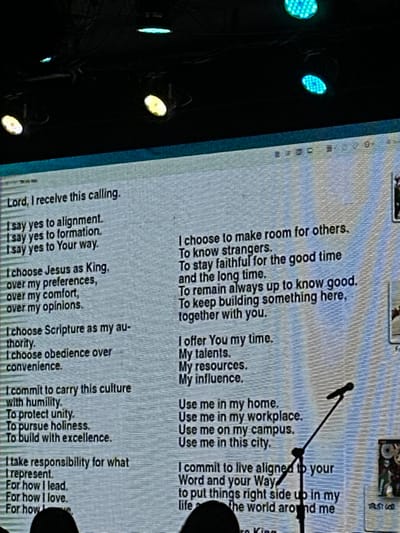 The image displays a screen with a prayer or declaration of faith. It includes phrases such as "Lord, I receive this calling," "I say yes to alignment," "I choose Jesus as King," and "I offer You my time." The text expresses a commitment to service, humility, and living according to religious principles, including building community and using one's resources for good. It also acknowledges personal choices to prioritize faith over personal preferences.
