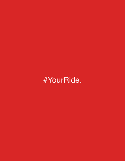 A red background with the white text "#YourRide." is displayed in the center of the image. The text is straightforward and utilizes a hashtag, commonly used in social media.