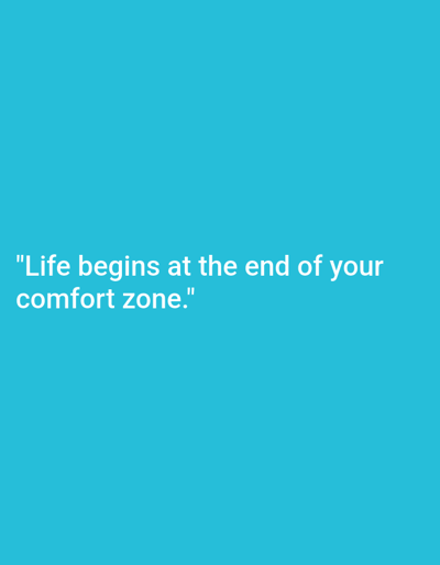 The scene is located in the city of Magaluf, Spain. The image itself features a solid, uniform teal-blue background. In the lower-left portion of the frame, white sans-serif text is centrally displayed, reading: "Life begins at the end of your comfort zone." There are no human figures, specific objects, or environmental elements depicted beyond the colored background and the textual content.