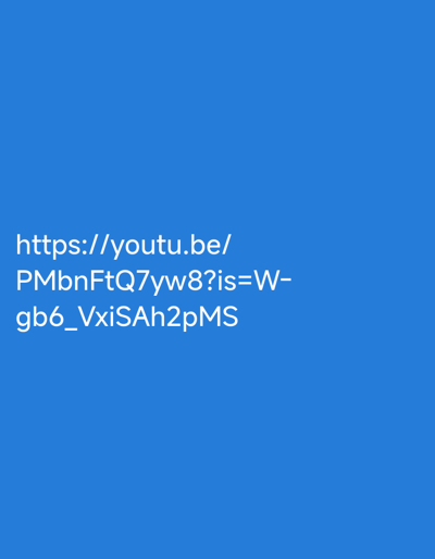 The image displays white text on a solid blue background. The text is a URL and reads: "https://youtu.be/PMbnFtQ7yw8?is=W-gb6_VxiSAh2pMS". There are no other objects or details visible in the image, and no location information can be inferred.
