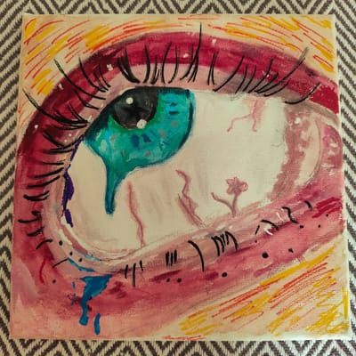 This is a close-up, square-format painting of a stylized human eye, rendered on canvas. The eye is depicted in a vibrant and somewhat abstract manner, with a large, bright teal iris with black pupil and white highlights. The surrounding eyelid and skin are painted in shades of pink and red, with expressive brushstrokes. Red and yellow lines radiate outwards from the eye, suggesting light or emotion. The eye is also shown with tears, represented by drips of blue and purple paint. Within the white of the eye, there are faint pink lines that could represent blood vessels, and a small, stylized pink flower. Black, curved strokes are used to depict eyelashes. The painting exhibits a raw, emotional quality, possibly conveying distress or intense feeling. The canvas is placed on a grey and white patterned surface, which serves as the background. No text is visible in the image. The location context of Knowsley, United Kingdom, does not provide any specific cues within the artwork itself.