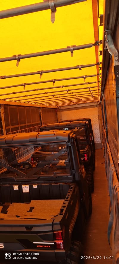 The image shows the interior of a truck or trailer with a yellow tarp ceiling. Multiple dark-colored utility vehicles, possibly ATVs or UTVs, are parked in a row. The vehicles have black roll cages, windows, and cargo beds. One vehicle in the foreground clearly displays the word "DIESEL" and "RANGER" on its rear. The floor of the cargo area appears to be a dull, textured surface. Straps are visible hanging from the right side of the trailer. The lighting suggests an indoor or covered environment. A timestamp "2026/6/29 14:01" and text indicating "REDMI NOTE 9 PRO AI QUAD CAMERA" are present in the bottom right and left corners respectively. The location is stated as Valga city, Estonia.
