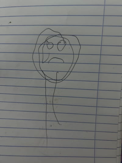 A simple line drawing on lined paper depicts what appears to be a sperm cell. The location of the image is impossible to ascertain from the available visual data. The surrounding environment is just lined paper. There is no information to indicate that the image has any connection to the city of San Juan de Los Morros, Venezuela, or anything to identify subjects, actions, or interactions.