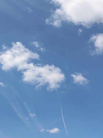 This media file features a bright blue sky with scattered white clouds. The clouds vary in size and density, with some appearing wispy and others more substantial. There are also several contrails visible, which are long, thin lines of condensed water vapor formed by aircraft. The contrails create a sense of movement and depth in the sky.
The overall impression is one of a clear and sunny day, likely during the daytime, given the brightness of the sky. There are no people or man-made objects explicitly visible in the frame, suggesting the focus is on the natural beauty of the sky. The image captures a serene and expansive view, evoking a feeling of peace and openness. The location context of Скурыгино, Russia, suggests this is a snapshot of the sky above that particular area. The weather appears to be fair, with the presence of clouds indicating atmospheric activity but not any severe conditions. There is no visible text within the image.